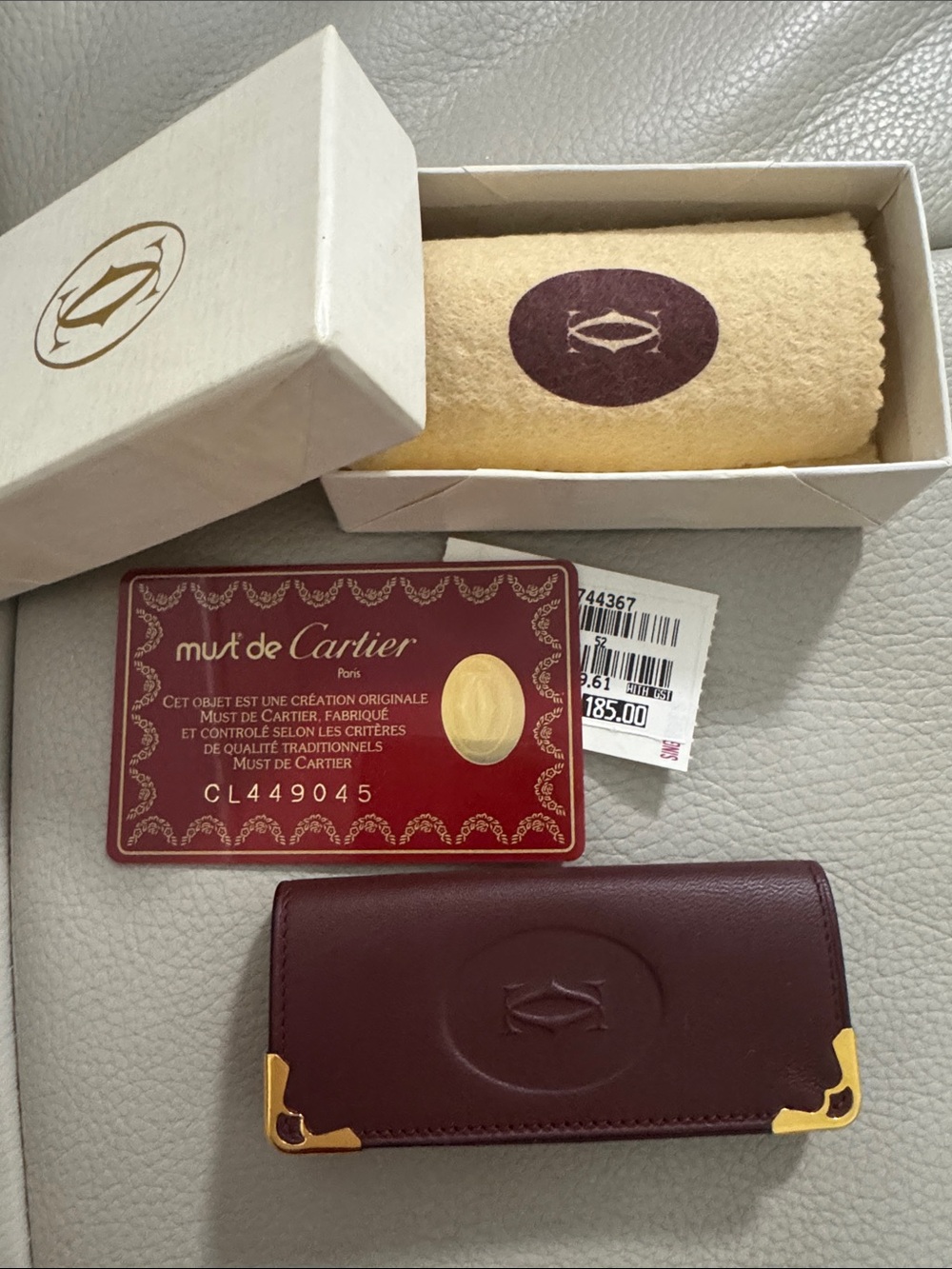 Cartier Burgundy Leather Key  Holder with Gold Accents.